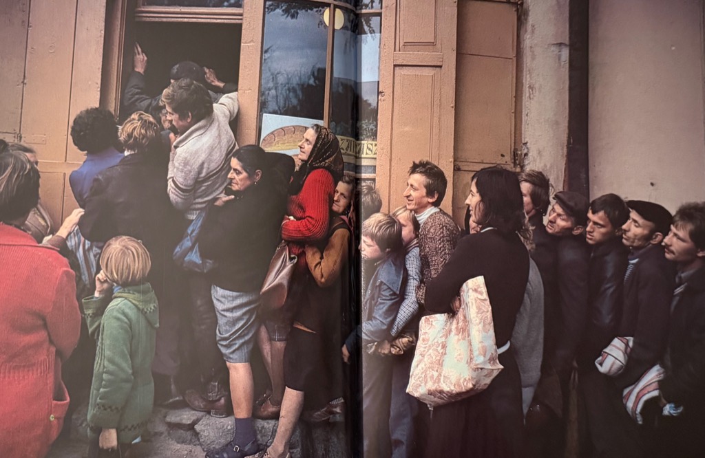 People waiting in line outside a store